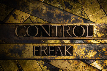 Control Freak text on vintage textured copper and gold background