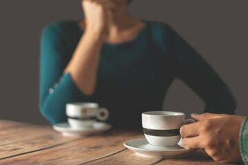 
Two people drink coffee in a cafe.Coffee concept