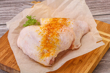 Raw chicken thigh with spices