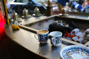 selective focus, Turkish coffee cooked on charcoal for tourists in Eminönü