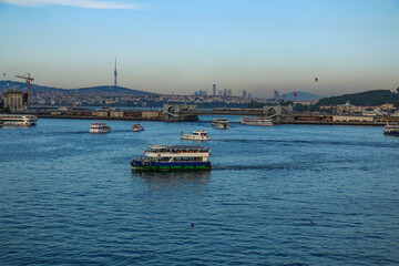 selective focus, 26.06.2021 ISTANBUL, Turkey: Eminonu Golden Horn metro, silhouettes of istanbul mosques from the metro station bridge