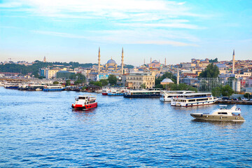 Fototapeta premium ISTANBUL, Turkey: Eminonu Golden Horn metro, silhouettes of istanbul mosques from the metro station bridge