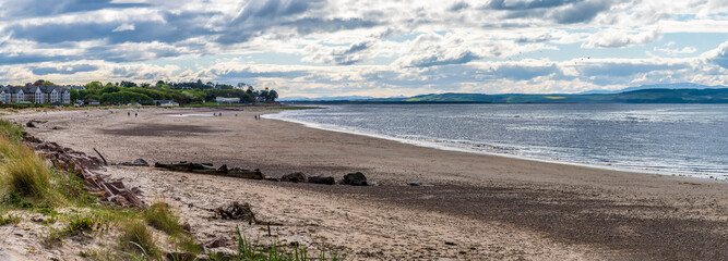 A panorama view along the beach at Nairn, Scotland on a summers evening