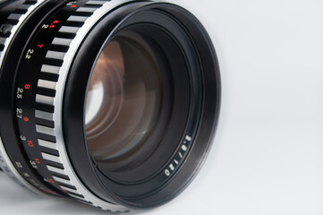 close-up vintage camera lens on white background