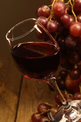 Still life with red wine and grapes