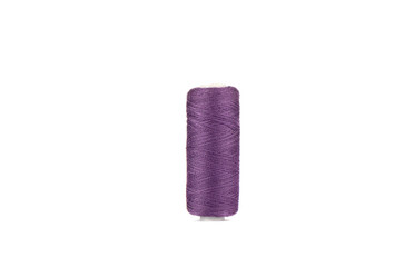 Spool of thread in purple color isolated on white background.