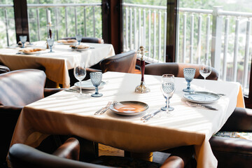 A beautifully laid table with exquisite dishes in a modern restaurant.