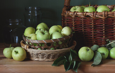 still life with apples. green apples in a basket.
