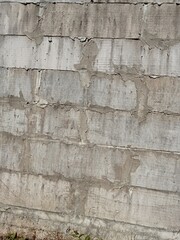 Pile of white bricks attached to the wall of the house