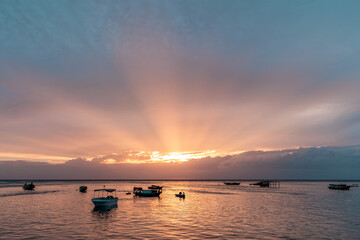 Fototapeta na wymiar Amazing light ray at sunset by the sea