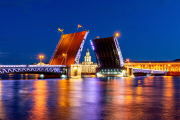 Naklejka na ściany i meble Raised Palace bridge and Kunstkamera museum at night, Saint Petersburg, Russia