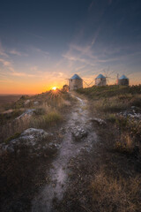 Fototapeta premium A sunset with windmills