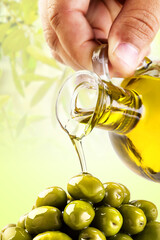 Olive oil being poured over olives