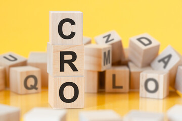 acronym CRO from wooden blocks with letters, concept