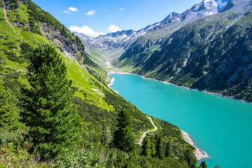 Naklejka na ściany i meble Vivid blue mountain lake in summer Alps. Speicher Zillergrundl dam, Zillertal Alps, Austria