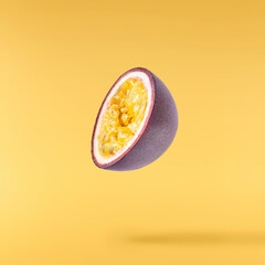 Fresh ripe passion fruit falling in the air