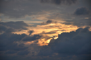 Golden afterglow among the dark blue clouds