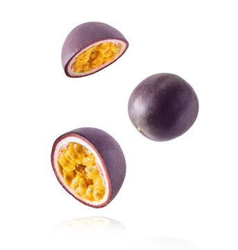 Fresh ripe passion fruit falling in the air