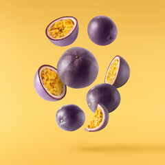 Fresh ripe passion fruit falling in the air