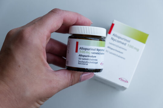 Tallinn, Estonia - July 16, 2021: Hand holding Allopurinol Nycomed by Takeda for gout treatment. Pharmacy and medicine concept.