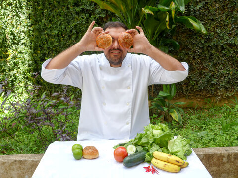 Man Dressed As Chef With Bread On Eyes, Funny Portrait
