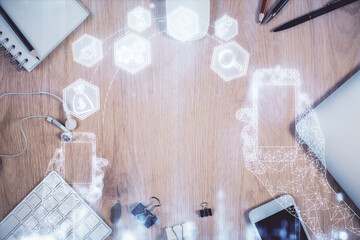 Multi exposure of technology theme drawing over table with phone. Top view. Concept of hightech.