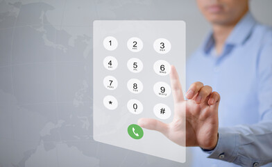Dialing on virtual telephone keypad with transparent telephone buttons, businessman touch button of telephone number on screen, Finger touch number on smartphone to make a call, close up,