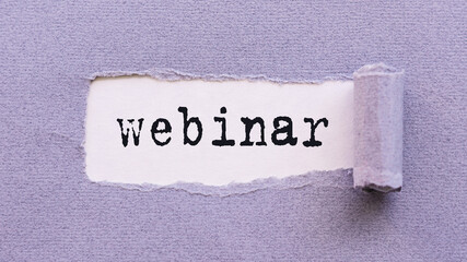 The text WEBINAR appears on torn lilac paper against a white background.
