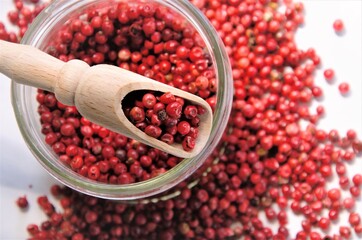 pepper peas red pink in a jar with wooden false