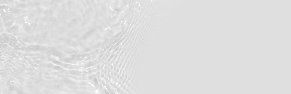 Water texture with circles on the water overlay effect for photo or mockup. Organic light gray drop shadow caustic effect with wave refraction of light. Long banner with copy space.