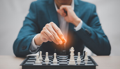 Planning and Decision concept, Businessman with strategy competitive ideas concept with chess board...