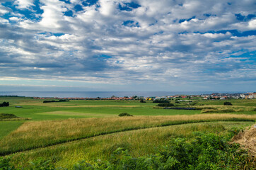 Fototapeta premium Green coast of Cantabria, northern Spain, at sunset