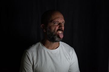 Fototapeta premium portrait of a man joking with his tongue out