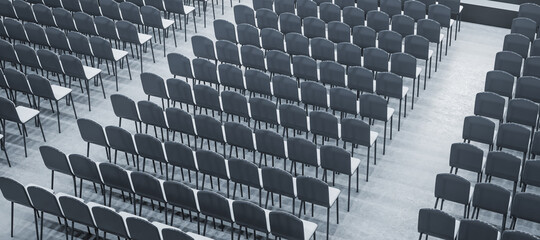 Top view of seats in modern grey auditorium interior. Public arrangement concept. 3D Rendering.