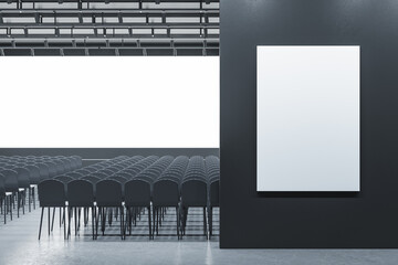 Modern grey auditorium with seating and empty screen with mock up poster for your advertisement. Show premiere and entertainment concept. 3D Rendering.