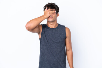 Young sport caucasian man isolated on white background covering eyes by hands. Do not want to see something