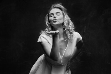 A girl poses at the camera in the image of the famous film actress