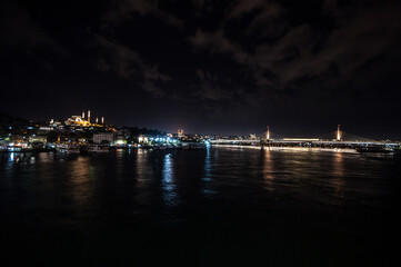 Night lights on Hagia Sophia under a full moon at twilight in Istanbul Turkey