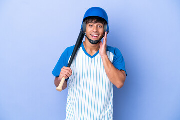 Baseball caucasian man player with helmet and bat isolated on blue background with surprise and shocked facial expression