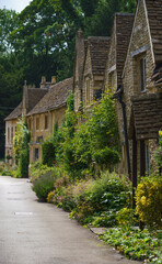 Fototapeta na wymiar beautiful 16th / 17th century cottage properties in the scenic Wiltshire UK Cotswold village of Castle Combe