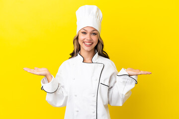 Young Russian chef girl isolated on yellow background with shocked facial expression