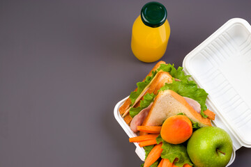 Healthy food concept. Lunch box at school and office on a dark background. Social distance, stay...