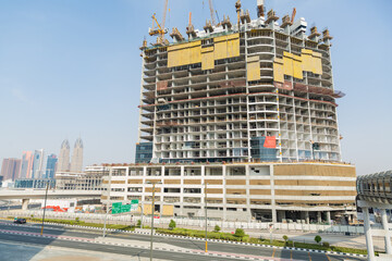 Fototapeta premium big building under construction in dubai, united arab emirates
