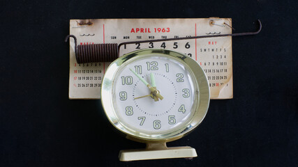 Naklejka premium Alarm Clock, Spring, and a Old Calendar