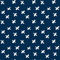 Vector pattern of their white crosses on a dark blue background. Calligraphic style. Brush strokes. Doodle. Hand drawing. Minimalism
