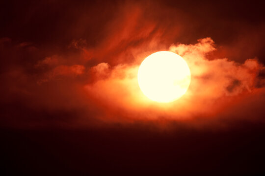 Setting sun among clouds