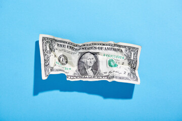 One dollar bill on blue background
