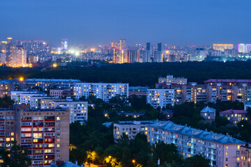 Fototapeta na wymiar Moscow, Russia - May 26, 2021: Night view from the Cosmos Hotel on the buildings of the city of Moscow. The surroundings around VDNKh and Ostankino TV Tower.