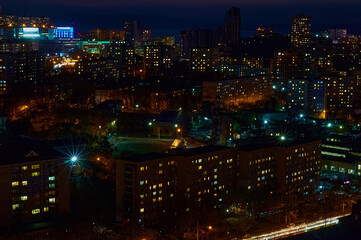 Fototapeta na wymiar Aerial view of the night city of Vladivostok, Russia. Illumination of city lights.