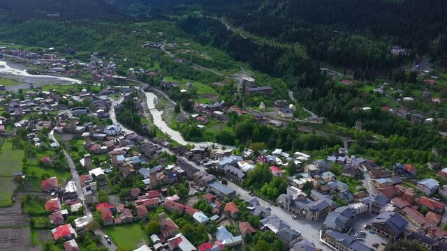 Aerial shot of Mestia township in Caucasus Mountains valley, Georgia, 4K view